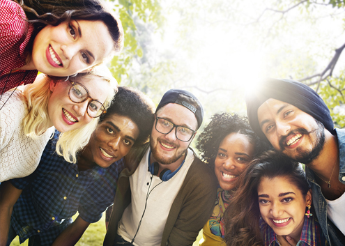 Image of a group of people standing in a semi-circle.